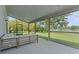 Relaxing screened patio overlooking a picturesque pond and lush greenery at 9319 Marsh Oaks Ct, Orlando, FL 32832