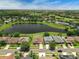 The aerial shows the property backing to a large lake with golf course and many residences nearby at 10151 Chorlton Cir, Orlando, FL 32832