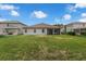 This home has a nice lawn, with a screened patio area, and ample sunlight in the backyard at 10151 Chorlton Cir, Orlando, FL 32832