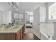 Charming bathroom features a double vanity with a view into the Primary bedroom at 10151 Chorlton Cir, Orlando, FL 32832