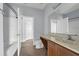 Bathroom featuring tile flooring, vanity sink, toilet, and shower with open door at 10151 Chorlton Cir, Orlando, FL 32832