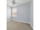 Cozy bedroom features a ceiling fan, natural light and neutral decor at 10151 Chorlton Cir, Orlando, FL 32832