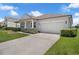 This charming home boasts an attached two-car garage and meticulously maintained landscaping at 10151 Chorlton Cir, Orlando, FL 32832