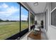 Relax on the lanai with lake views and room for comfortable seating at 10151 Chorlton Cir, Orlando, FL 32832