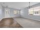 Bright and airy living room with tile flooring, a large window, and an open space for furniture arrangement at 10151 Chorlton Cir, Orlando, FL 32832