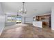 Spacious open living area combining living, dining, and kitchen spaces with ample light at 10151 Chorlton Cir, Orlando, FL 32832