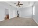 Bright and spacious main bedroom with a ceiling fan and ensuite bathroom access at 10151 Chorlton Cir, Orlando, FL 32832