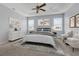 Serene main bedroom with a ceiling fan, carpeted floors, and natural lighting at 10151 Chorlton Cir, Orlando, FL 32832
