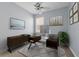Bright home office features a modern desk, stylish decor, and a calming atmosphere at 10151 Chorlton Cir, Orlando, FL 32832