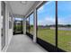 Covered patio with views of the backyard and lake at 10151 Chorlton Cir, Orlando, FL 32832