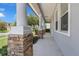 Inviting front porch with stone accents and elegant columns, perfect for relaxing and enjoying the neighborhood at 10151 Chorlton Cir, Orlando, FL 32832