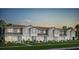 Charming townhomes boasting a landscaped lawn and a welcoming curb appeal perfect for modern living at 10282 Hadley St, Orlando, FL 32829