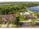 Aerial shot of home, community pool, and nearby pond at 11081 Savannah Landing Cir, Orlando, FL 32832