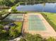 Community amenities featuring a tennis court and basketball court near a beautiful pond at 11081 Savannah Landing Cir, Orlando, FL 32832
