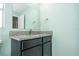 Bathroom features black cabinets, granite countertop, sink, faucet, mirror and green walls at 11081 Savannah Landing Cir, Orlando, FL 32832