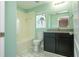 Bathroom features a tile floor, black cabinets, granite countertop, sink, toilet and shower with tub at 11081 Savannah Landing Cir, Orlando, FL 32832