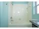 Bright bathroom features a white tile shower with a shower head and updated faucet at 11081 Savannah Landing Cir, Orlando, FL 32832