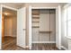 Open closet with shelving system, providing ample storage space at 11081 Savannah Landing Cir, Orlando, FL 32832