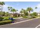View of the community clubhouse, pool parking, and adjacent green space at 11081 Savannah Landing Cir, Orlando, FL 32832
