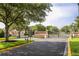 Gated entrance with landscaping at the front of the community at 11081 Savannah Landing Cir, Orlando, FL 32832