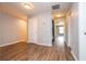 Interior hallway with wood-look vinyl flooring and neutral walls, showcasing access to various rooms at 11081 Savannah Landing Cir, Orlando, FL 32832