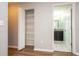 Hallway with closet and bathroom views; neutral walls and wood-look vinyl flooring throughout at 11081 Savannah Landing Cir, Orlando, FL 32832