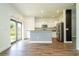 Bright kitchen featuring stainless steel appliances, granite countertops, and access to the backyard at 11081 Savannah Landing Cir, Orlando, FL 32832