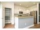 Bright kitchen featuring stainless steel appliances, granite countertops, and a well-organized pantry at 11081 Savannah Landing Cir, Orlando, FL 32832