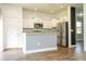 Well-designed kitchen featuring stainless steel appliances, white cabinets, and an eat-in bar area at 11081 Savannah Landing Cir, Orlando, FL 32832