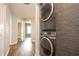 Laundry room includes grey stacked washer and dryer appliances, plus additional space throughout the house at 11081 Savannah Landing Cir, Orlando, FL 32832