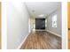 Spacious living room featuring a modern accent wall and durable wood-look flooring at 11081 Savannah Landing Cir, Orlando, FL 32832