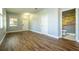 Open living room space with hard surface floors leading to a half bathroom at 11081 Savannah Landing Cir, Orlando, FL 32832
