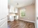 Office features hardwood floors, white cabinets, a desk and a window with natural light at 11081 Savannah Landing Cir, Orlando, FL 32832