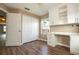 Office space features hardwood floors, closet, white desk and cabinets, and a sunlit window at 11081 Savannah Landing Cir, Orlando, FL 32832