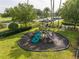 A playground on a lush lawn in a Gathering-friendly neighborhood at 11081 Savannah Landing Cir, Orlando, FL 32832