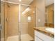 Shower has tile surround, glass door, and updated fixtures at 11081 Savannah Landing Cir, Orlando, FL 32832