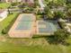 Community tennis and basketball courts in a well-maintained fenced-in area at 11081 Savannah Landing Cir, Orlando, FL 32832