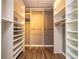 Walk-in closet featuring custom shelving and ample storage at 11081 Savannah Landing Cir, Orlando, FL 32832
