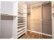 Walk-in closet offering ample storage with custom shelves and hanging rods at 11081 Savannah Landing Cir, Orlando, FL 32832