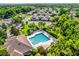 Aerial view of community amenities including a pool, lounge area, and well-maintained landscaping at 1122 Sandstone Run, Sanford, FL 32771
