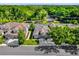 Aerial view of the property showcasing well-manicured lawns, mature trees, and a desirable neighborhood at 1122 Sandstone Run, Sanford, FL 32771
