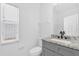 Bathroom featuring a granite vanity, a single sink, a mirror, and a toilet at 1122 Sandstone Run, Sanford, FL 32771