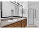Bathroom featuring a double sink vanity with granite countertop and a glass door shower at 1122 Sandstone Run, Sanford, FL 32771