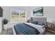 Serene bedroom with plush bedding, natural light, and soothing wall art creating a peaceful retreat at 1122 Sandstone Run, Sanford, FL 32771