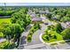 Landscaped community entrance with stone signage, mature trees, and well-maintained lawns at 1122 Sandstone Run, Sanford, FL 32771