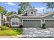 Charming home featuring a well-manicured lawn, neat landscaping and a large two car garage at 1122 Sandstone Run, Sanford, FL 32771