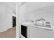 Laundry room featuring a washer, dryer, and shelving for convenient organization and storage at 1122 Sandstone Run, Sanford, FL 32771