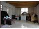 Large unfinished basement with a sliding glass door and an exterior window at 1211 Phillip St, Winter Springs, FL 32708