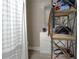 Practical bathroom with a vanity, mirror, shower curtain, and functional shelving at 1211 Phillip St, Winter Springs, FL 32708