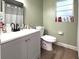 Neutral bathroom showcasing modern vanity, tiled shower and vinyl floor at 1211 Phillip St, Winter Springs, FL 32708